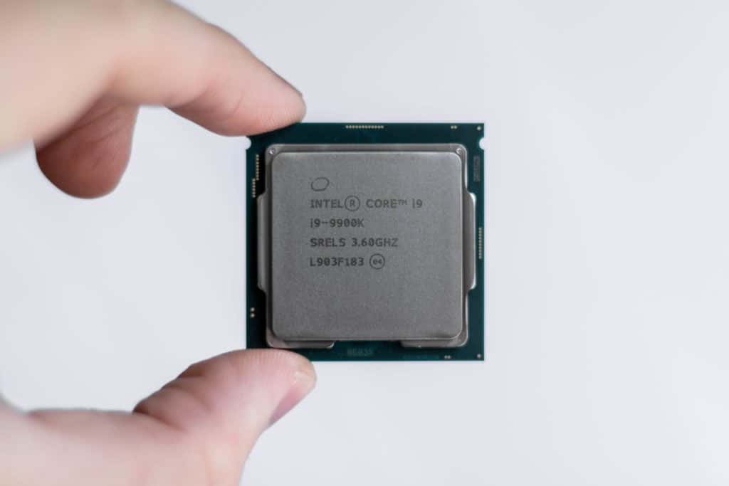 An Intel CPU being held